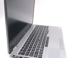 a laptop that is open on a white surface