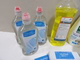 bottles of hand sanitizer and other cleaning products on a counter