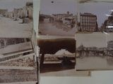 many old photos hanging on the wall of this room