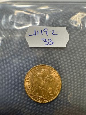 a close up of a coin in a plastic bag on a table