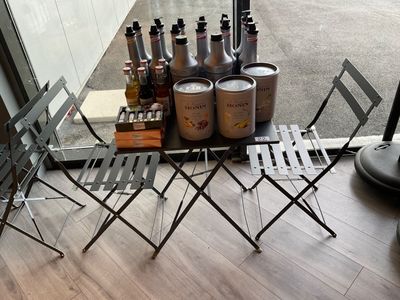 a table that has a lot of bottles on it