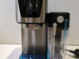 a water dispenser that is sitting on a counter