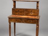 an old wooden desk with a drawer on top of it
