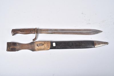 a knife and a knife holder on a white surface