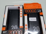 packaging of a black cell phone in a box on a table