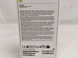 the back of a white box with a green sticker on it