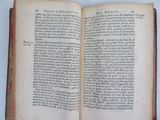 a book open on a table with a white background