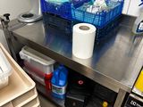 a metal table with a bunch of items on top of it