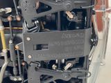 a close up of a machine that has a lot of wires attached to it
