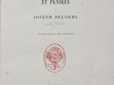 a close up of a book with a red cover on it