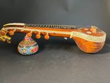 a close up of a musical instrument sitting on a table