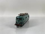 a toy train on a white surface with a white background