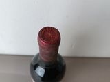 a bottle of wine that is sitting on a table