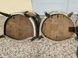 three wine barrels sitting on the floor next to each other
