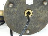 a metal object with a wire attached to it