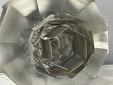 a metal sculpture of a flower on a white surface