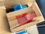 a cardboard box that is open on top of a desk