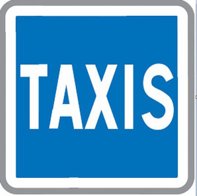 blue and white traffic sign with the word taxi written on it
