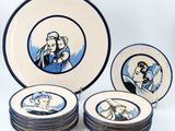 four plates with a picture of a man and a woman on them
