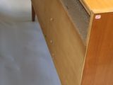 a wooden desk with a drawer on top of it