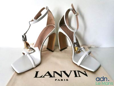 an image of a pair of white high heeled shoes on a bag