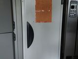 a picture of a refrigerator in a kitchen with the door open