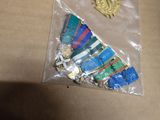 a bag of medals and a medal on a table