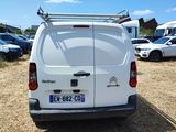 a white van that is parked in a parking lot