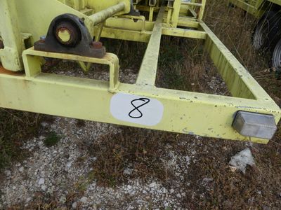 a close up of a yellow trailer with a number on it