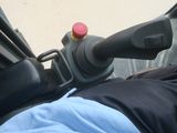 a close up view of a person driving a vehicle