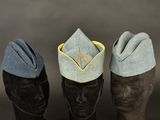 three hats are lined up on top of a mannequin head