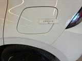 a white car with a sticker on the side of it