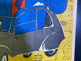 a poster of a man in a suit and tie driving a car