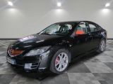 a picture of a black car that is on a checkered floor