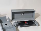 a gray box with a game controller inside of it
