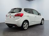 a picture of a white car parked in a showroom