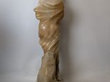 marble statue of a woman with a shaw around her neck