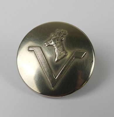 an image of a metal button with a deer head on it