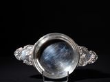 an image of a silver ring with a blue star in the center