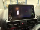 a picture of a car dashboard with a cell phone in it