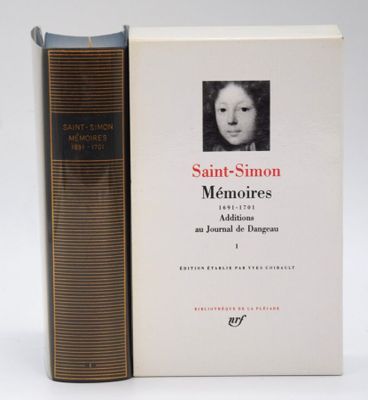 two books sitting next to each other on a white surface