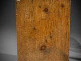 an old wooden box with a tag on it