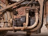 an old motorcycle that is rusted and rusted up