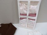 a white box with three pairs of socks in it