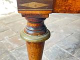 a close up of a wooden table with a drawer on it