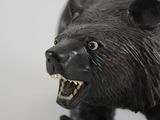 a black bear figurine that is on a table