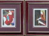 two framed paintings of a woman in a red dress and a woman in a red dress