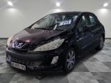 a picture of a small black car parked in a garage