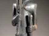 a statue of a man with a hat and a cane
