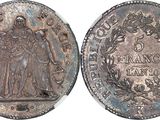 a close up of a coin with an image of a woman on it